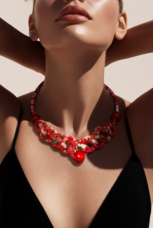 Handmade red braided statement necklace with bold beads and artistic knots. Lightweight, vibrant, and designed to add instant personality to any outfit.